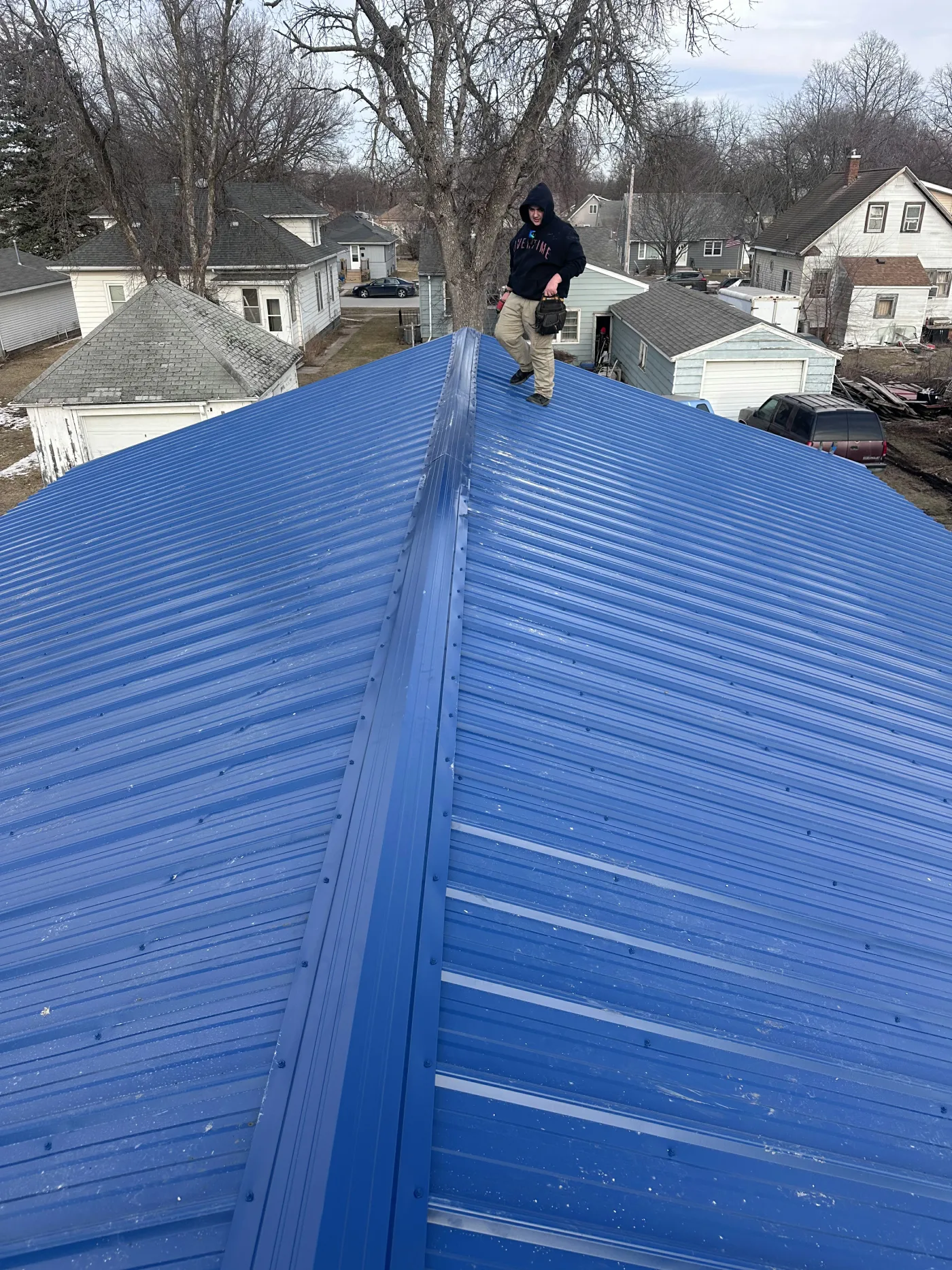 Metal roof replacement on agricultural machine shed in North Iowa