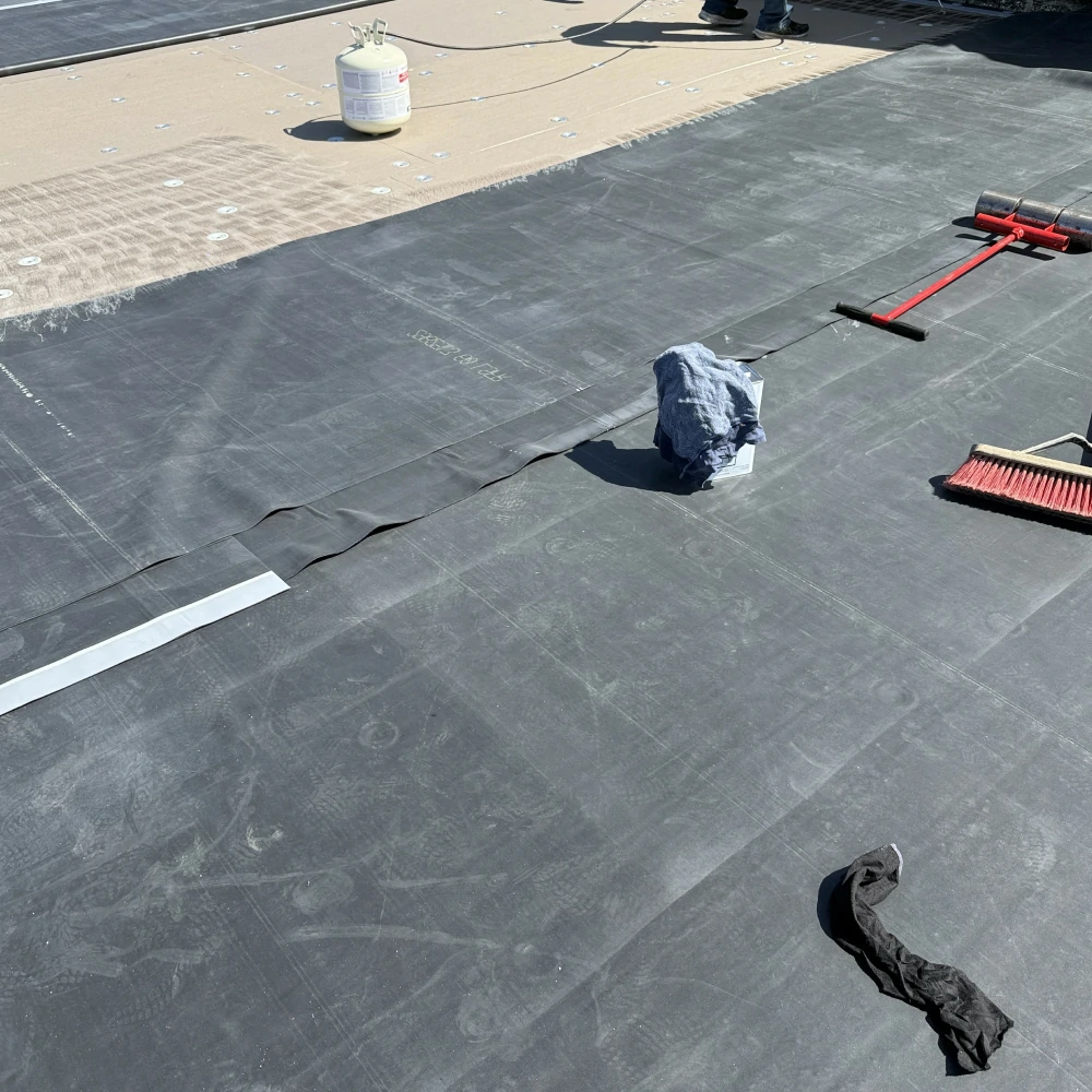 EPDM rubber roof being installed on Mason City Iowa building