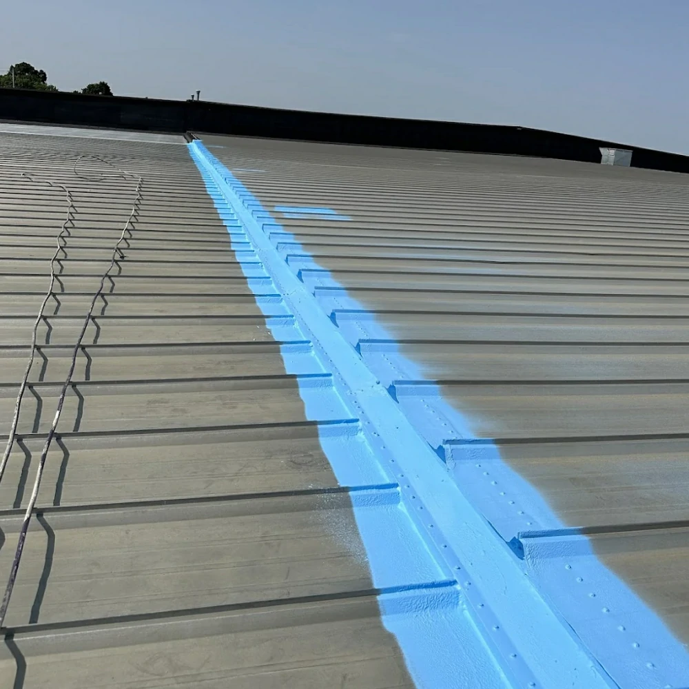 Standing seam metal roof panels being installed in Mason City Iowa